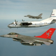 Two Danish Air Force F-16AMs escort a Russian An-30 on an Open Skies mission. OSCE Photo